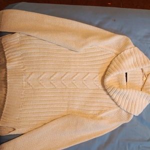 Cream colored long sleeve turtleneck.